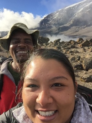 Brandi Ng-See-Quan and her guide ‘Good Luck’ at the start of her ascent of Mt. Kilimanjaro