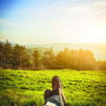 Feet crossed relaxing in nature