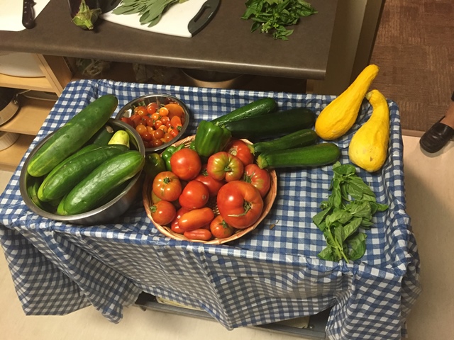 The group gathered to make a meal from the vegetables they grew in their garden